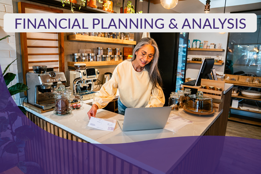 Mature female business owner reviewing financial information in order to do an FP&A process