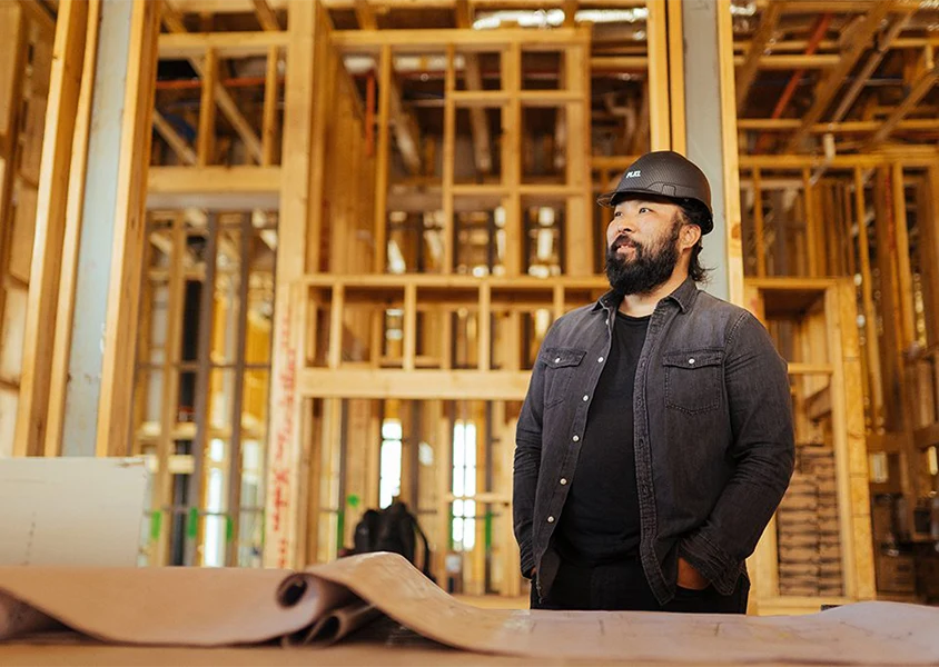 Lendistry client PIKL standing in framing for a commercial building