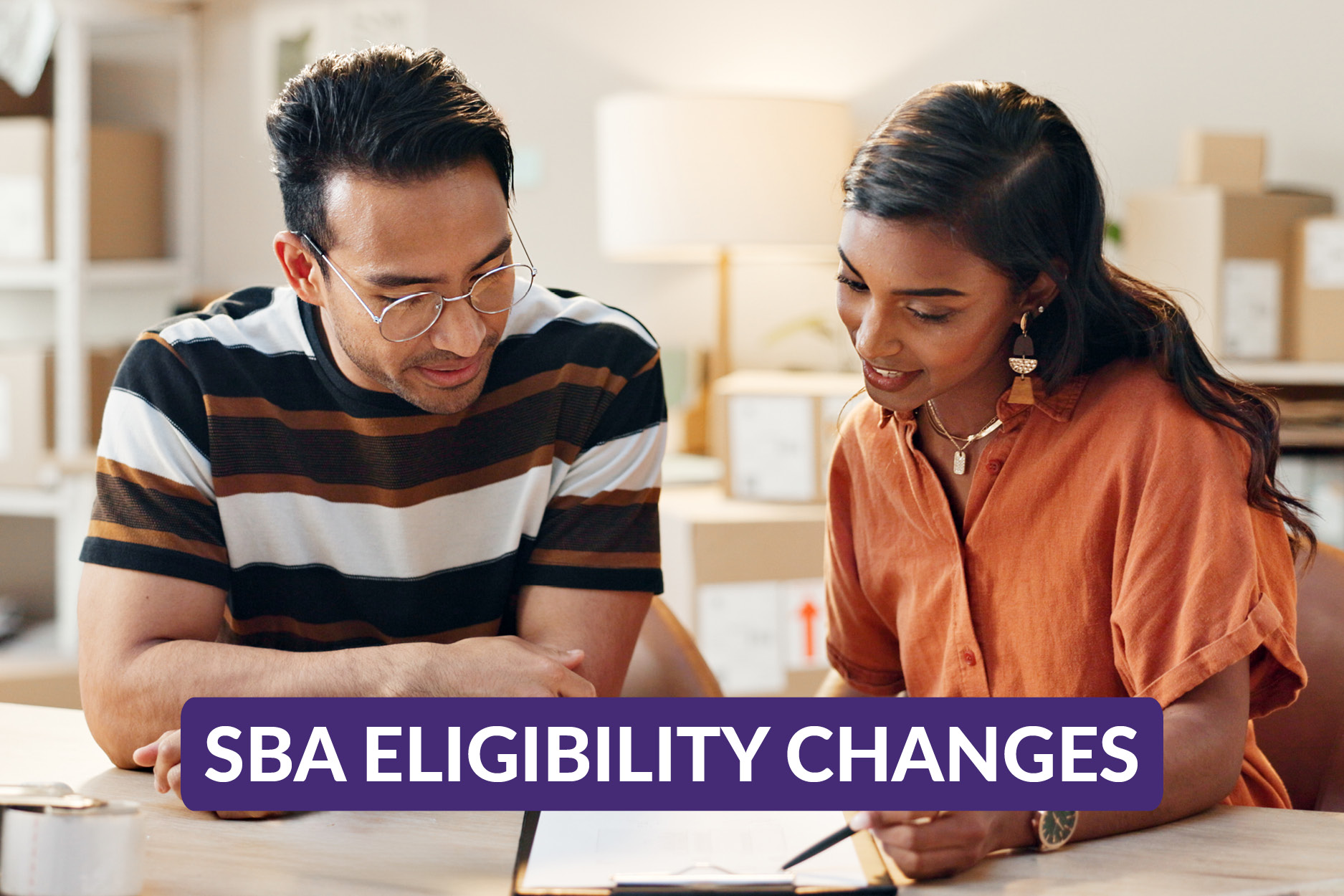 Small Business partners reviewing information on the recent SBA eligibility changes
